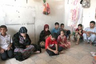 Shi'ite Turkmen families, who have fled the violence in Mosul, gather at a Shi'ite mosque in the town of Nahrawan, east of Baghdad