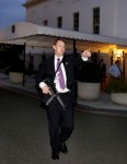 A U.S. Secret Service agent with an automatic rifle instructs people to evacuate the White House complex moments after U.S. President Barack Obama and his family left for the presidential retreat, Camp David, in Maryland