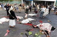 Dead and wounded men are seen at the site of a suicide attack in Sanaa