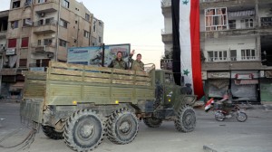 Syrian pro-government forces wave from i