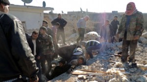 Syrians search for survivors under the r