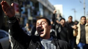 Palestinian reacts in front of the body of Islamic Jihad militant al-Ijla during his funeral in Gaza