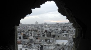 Damaged buildings are pictured in the besieged area of Homs
