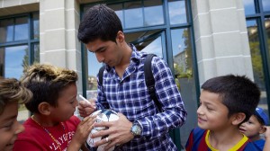 Uruguayan striker Suarez signs autograph after his hearing at the Court of Arbitration for Sport in Lausanne