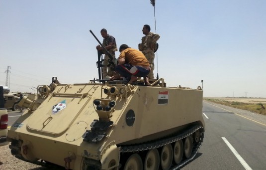 Members of Iraqi security forces and tribal fighters take part in an intensive security deployment on the outskirts of Diyala province