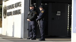 United Nations security officers stand guard outside the U.N. European headquarters in Geneva