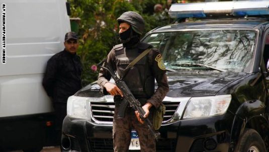 Egyptian security forces stand guard around the Coptic Catholic College of Theology and Humanities in the southern Cairo suburb of Maadi on April 29, 2017, during Pope Francis' visit to the country. / AFP PHOTO / Aly FAHIM        (Photo credit should read ALY FAHIM/AFP/Getty Images)