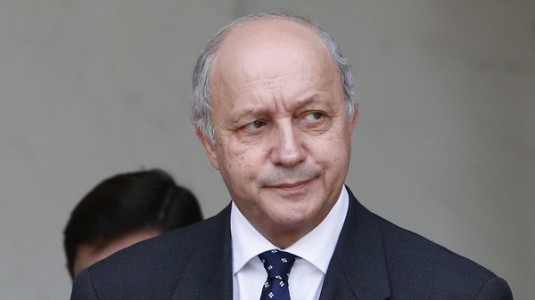 French Foreign Affairs Minister Laurent Fabius leaves at the end of the weekly cabinet meeting at the Elysee Palace in Paris, France