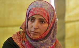 Yemeni activist Tawakel Karman holds a p